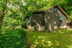 Side view of Asheville Cabin Overlooking Noisy Stream