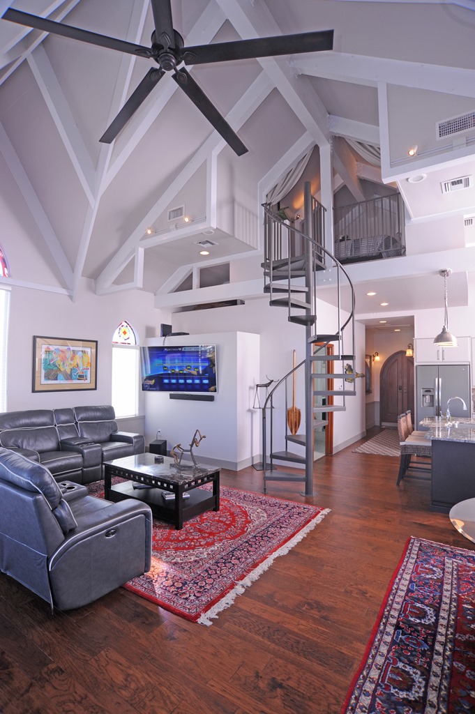 Thirty-five foot ceilings and spiral stairway in luxury houseboat for sale in Palmetto FL