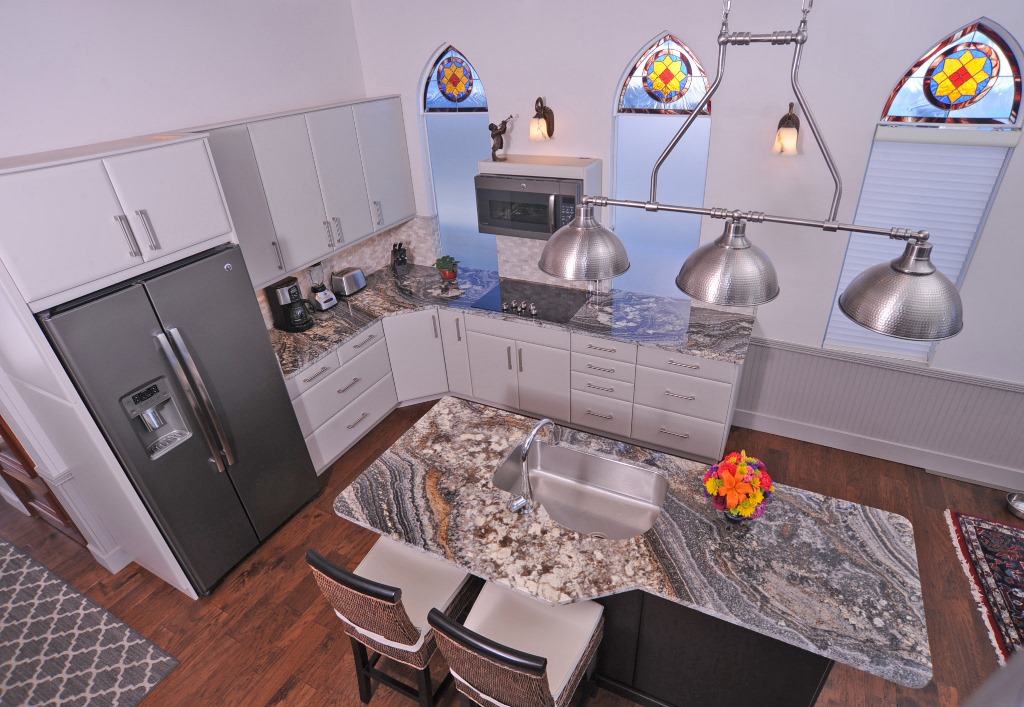 Open kitchen with granite counter tops at this houseboat for sale.