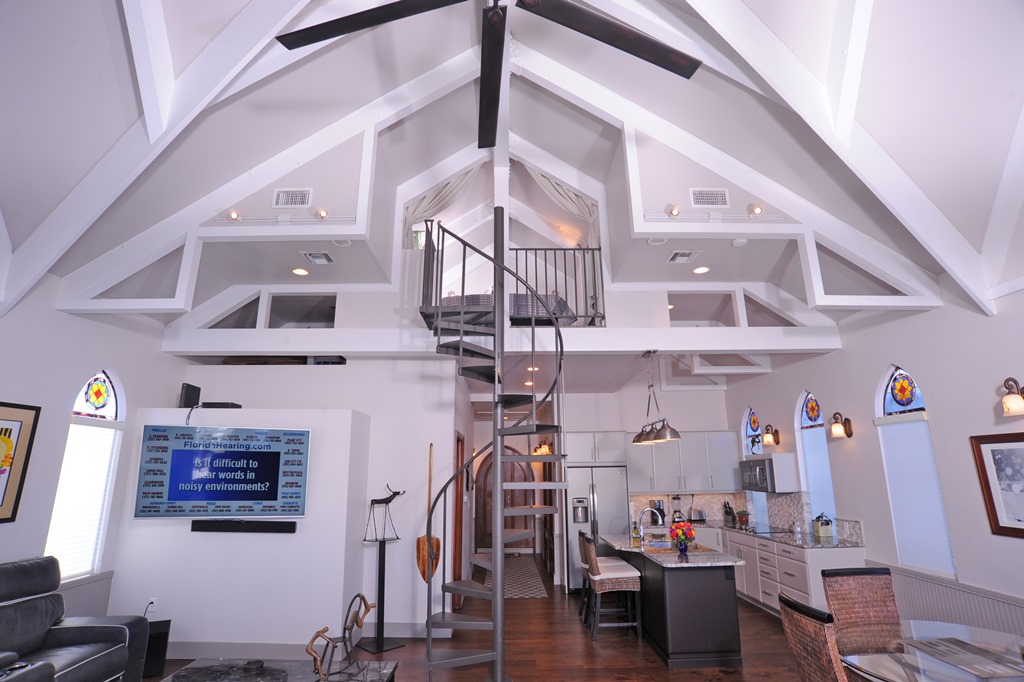 Tall ceilings and view of loft at the houseboat for sale.