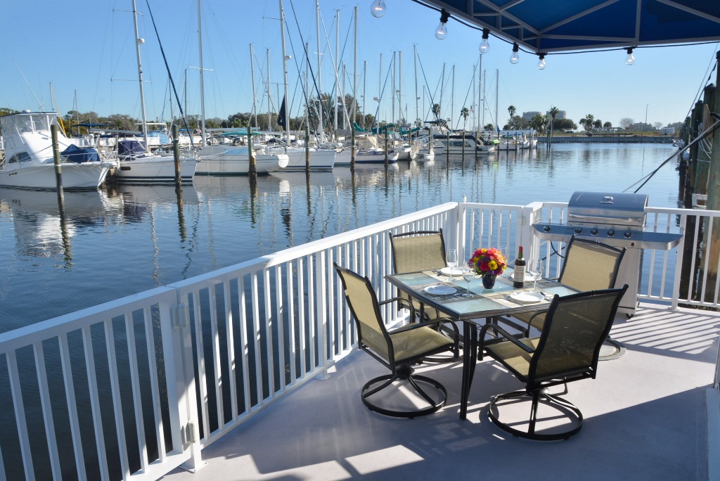 Enjoy the view from one of two covered decks on this houseboat for sale.