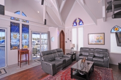 Cathedral ceiling, hardwood and tile floors in this famous houseboat for sale.