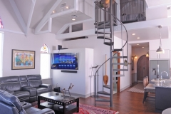 Thirty-five foot ceilings and spiral stairway in luxury houseboat for sale in Palmetto FL