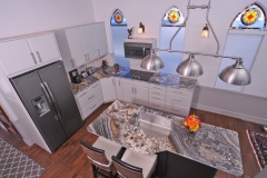 Open kitchen with granite counter tops at this houseboat for sale.