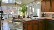 looking from the large kitchen into the sunroom at this RTP Home for sale