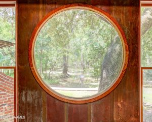Round window in the loggia at Bayou Magic