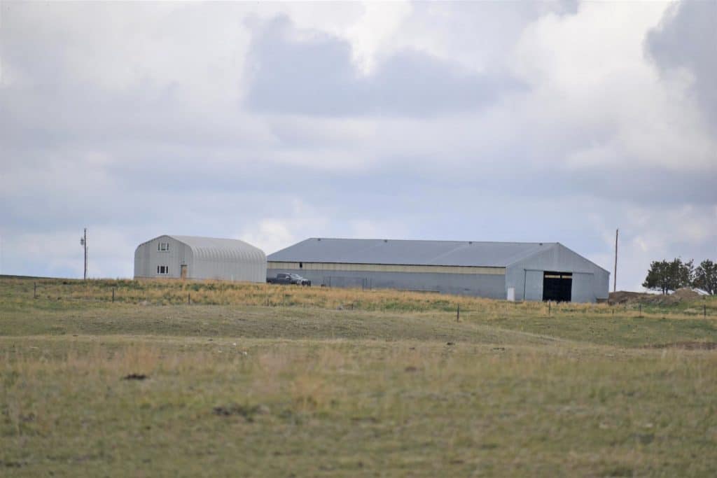 Montana Quonset Residence view with metal barn.