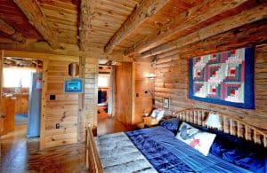 Master bedroom at the Shady Oak Log Cottage