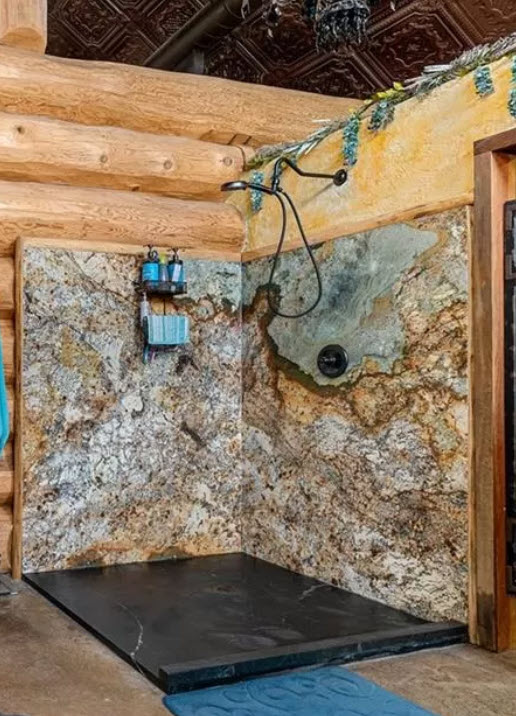 Granite Open Shower in this Pioneer Log Home