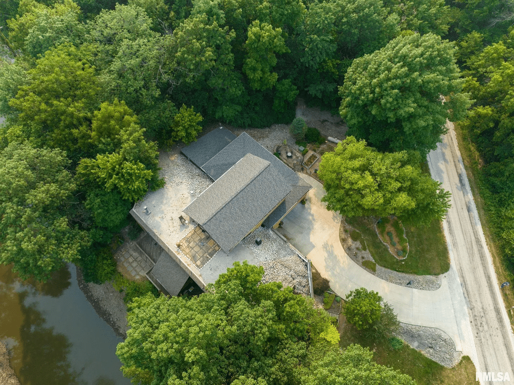Aerial view of the waterfront earth home on the banks fo the Sangamon River