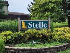 Community entrance sign to the Stelle Solar Home at 141 Tamarind Court Stelle, IL