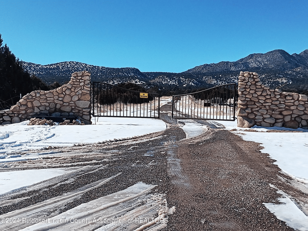 Large iron gates protecting the entrance to this Prepper Survivalist Ranch