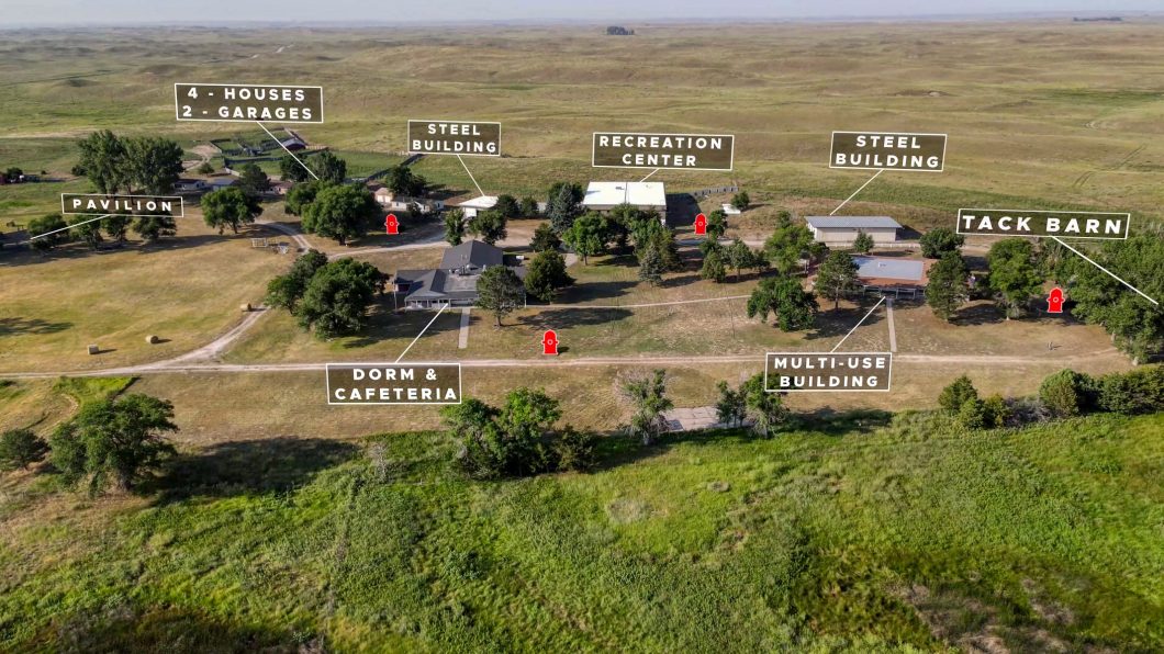 Aerial photo showing all the buildings offered in the auction of this sustainable living property.