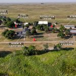 Aerial photo showing all the buildings offered in the auction of this sustainable living property.