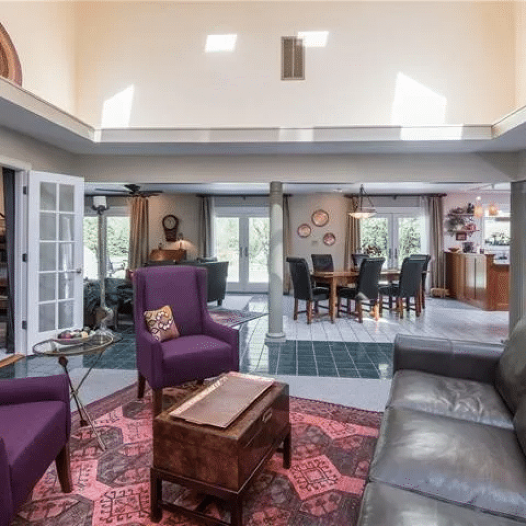 Interior of an earth-sheltered house with a conservatory ceiling.