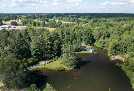 Aerial view of the pond at the prepper's waterfront paradise.