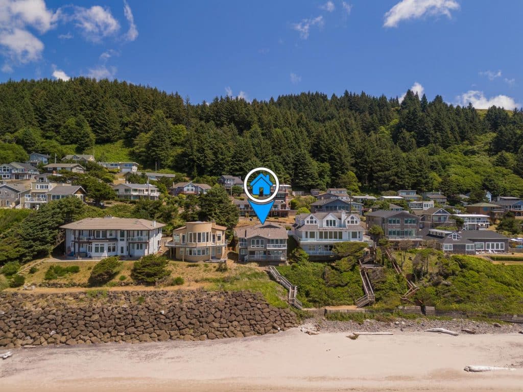 Aerial view of the steps leading down from the Road's End Oceanfront Home to the beach.