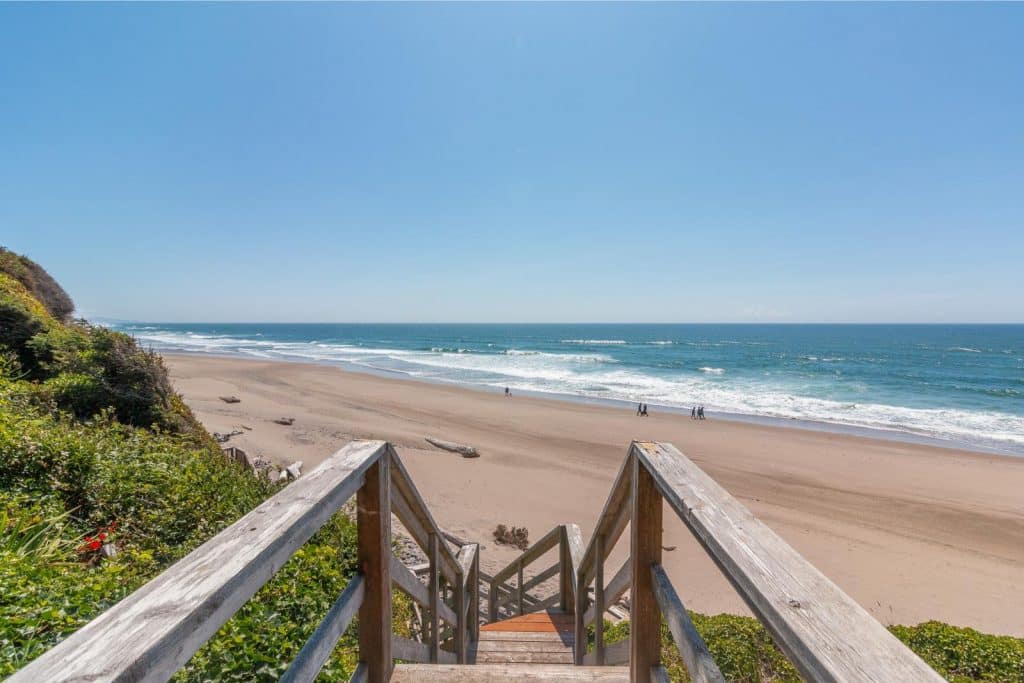 Steps leading directly from Road's End Oceanfront Home to the Pacific Ocean