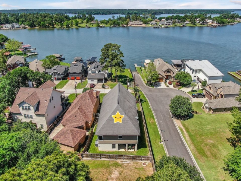 Aerial view of a home with Lake Conroe Water Views!